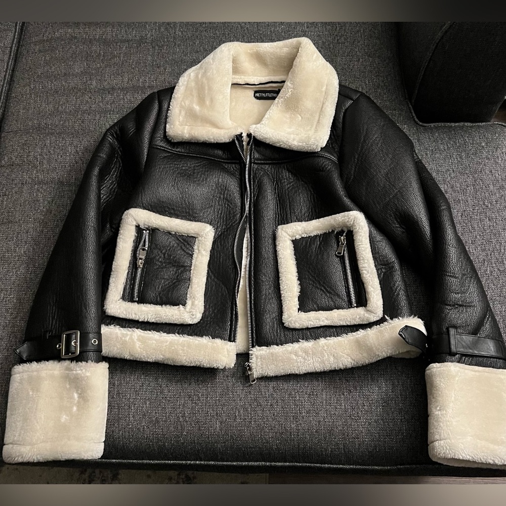 New faux leather jacket with faux fur lined inside. Very cozy, and soft.